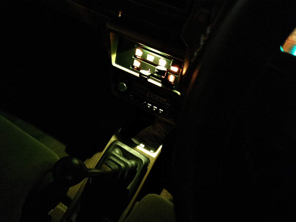 Dash illumination in a 1983 Citroen BX14RE, showing how the heater control illumination also provides a gentle wash to the whole centre console (camera makes it look a good deal brighter than in reality).