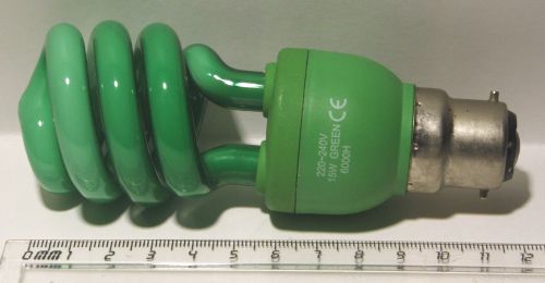 Impact Color Spiral 15W Green Coloured Compact Fluorescent Lamp - Shown adjacent to a ruler for scale