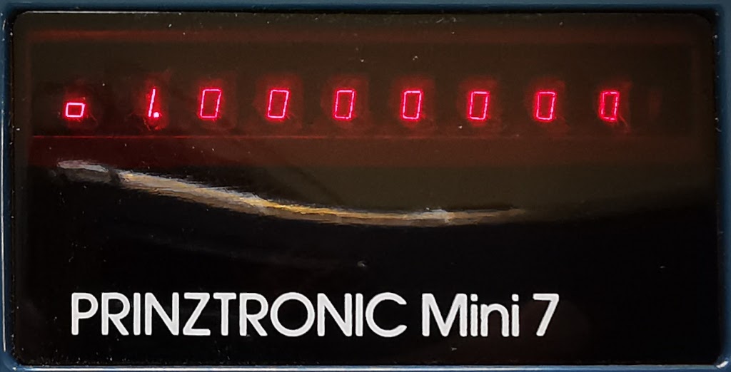 Detail of the display on a Prinztronic Mini 7 calculator showing an underflow condition
