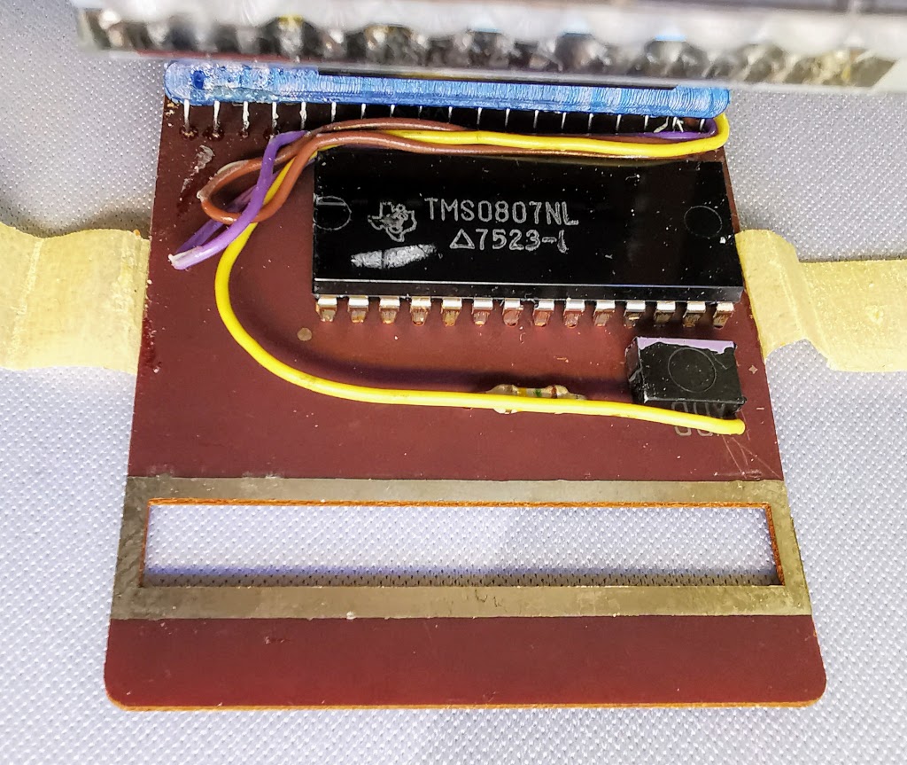 Detail of TI TMS0807NL IC in Prinztronic Mini 7 Calculator
