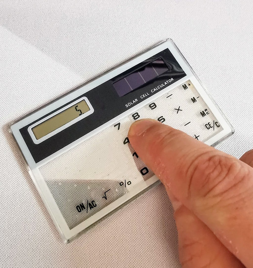 Showing how tiny the buttons on the generic transparent calculator are