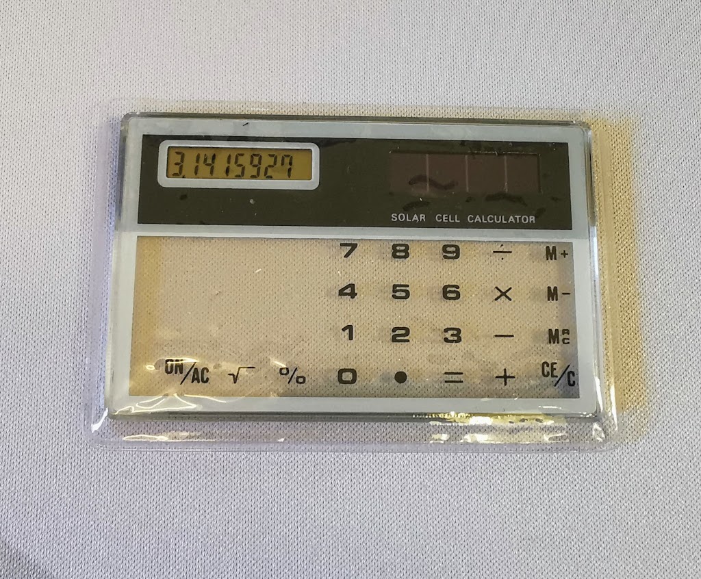Detail showing the generic transparent calculator in supplied clear slip case