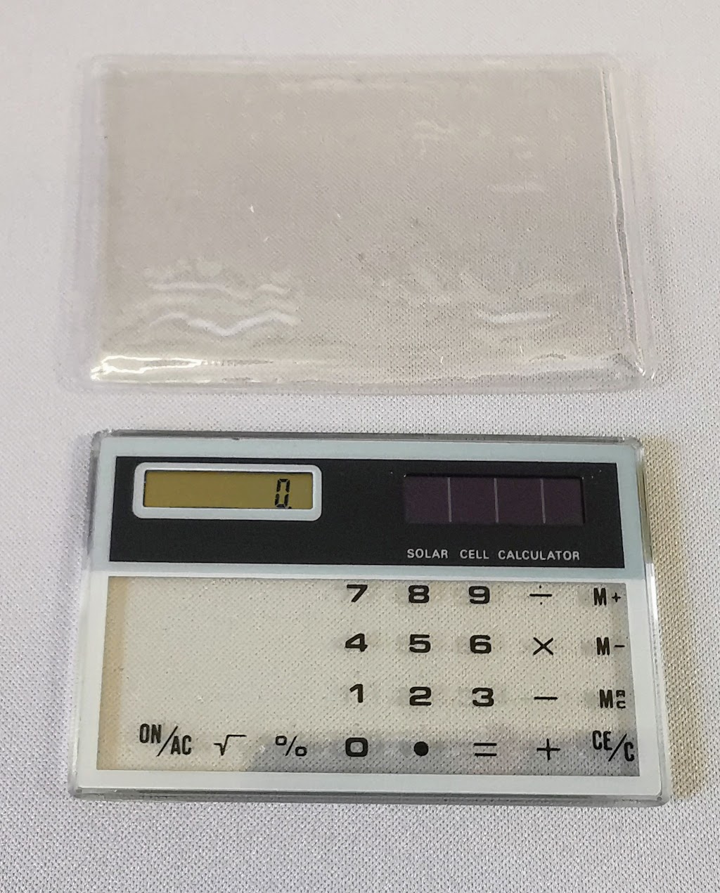 Detail showing the slip case provided with the generic transparent calculator