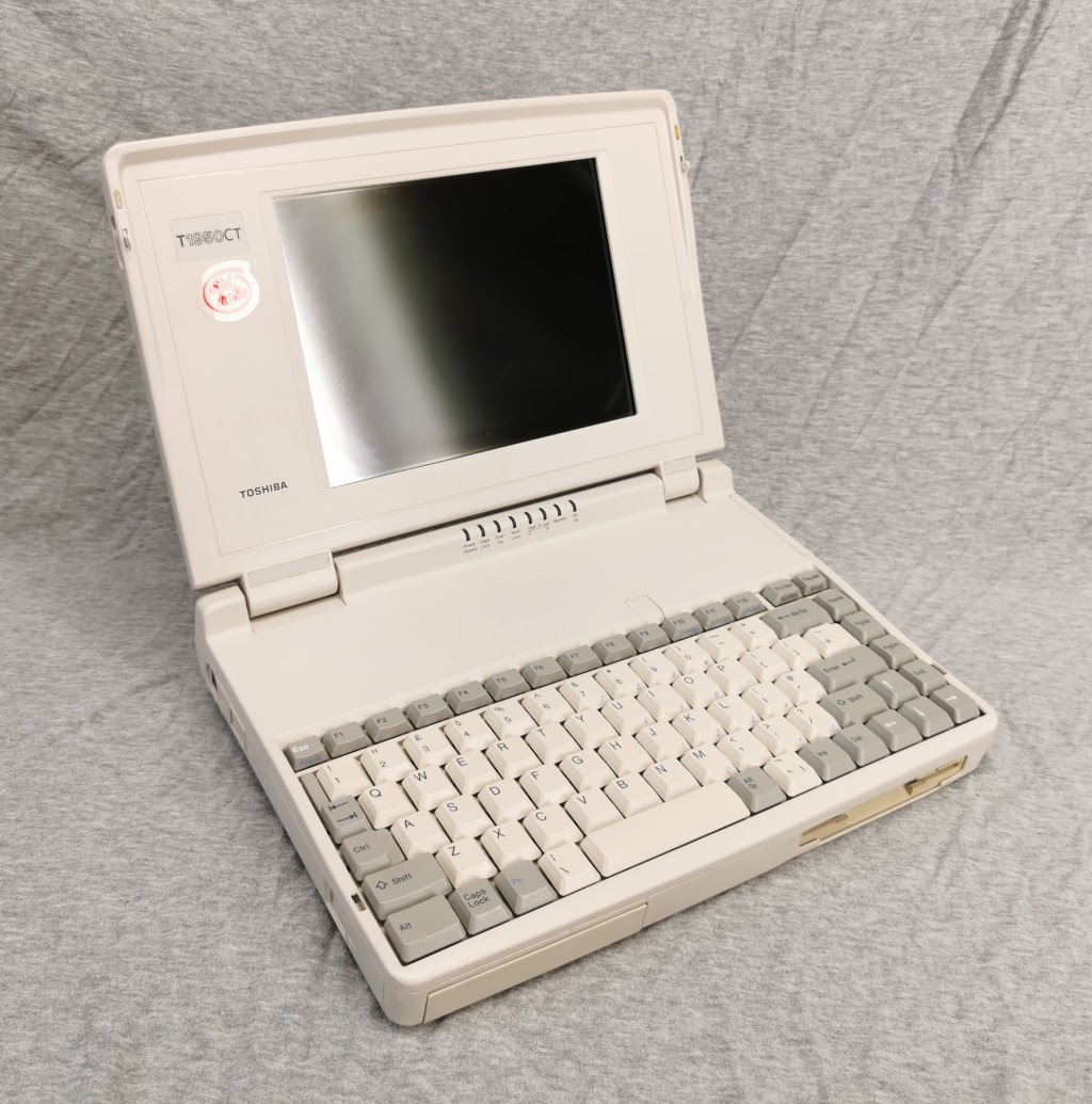 General view of Toshiba T1950CT with lid open from the left