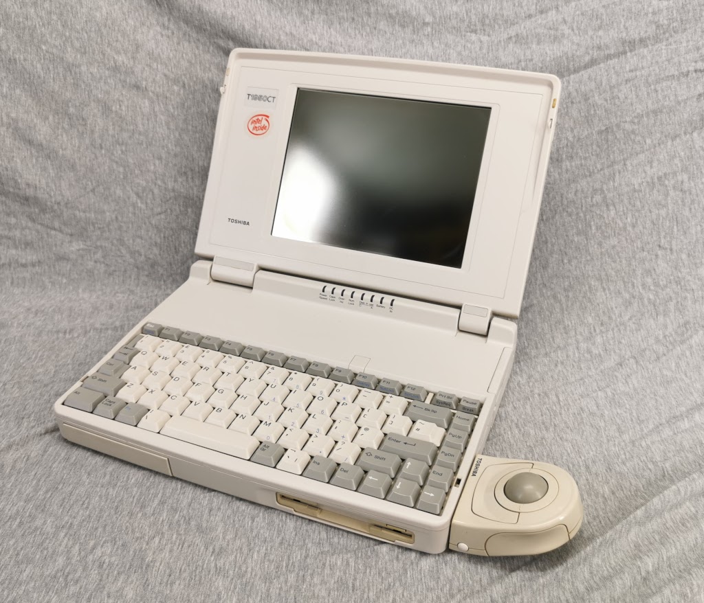 General view of Toshiba T1950CT with lid open from the right