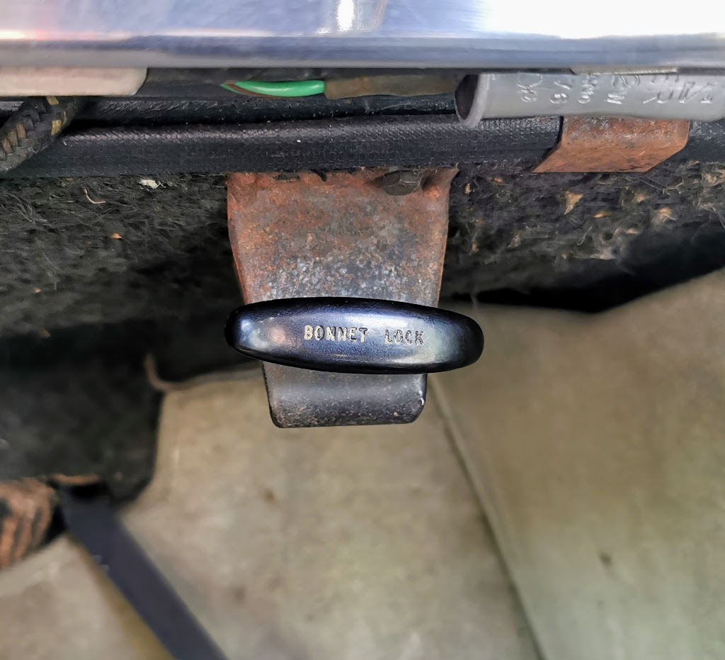 Detail of the bonnet release handle on a 1963 Rover P4