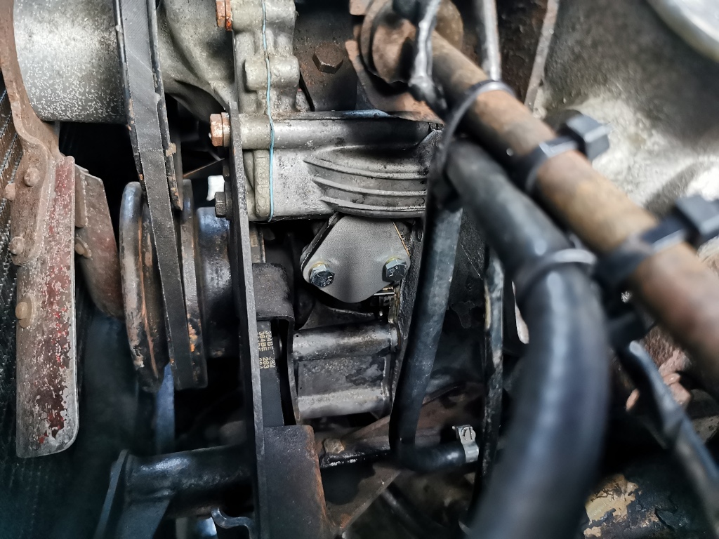 Blanking plate fitted in place of the mechanical fuel pump during an electric pump upgrade on a 1975 Rover P6