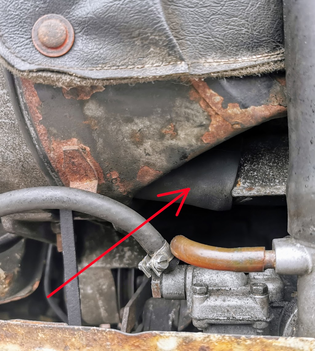 The often missing fan shroud to exhaust manifold jacket hose on a Trabant P601 - This tiny hose makes a huge difference to the performance of the cabin heater