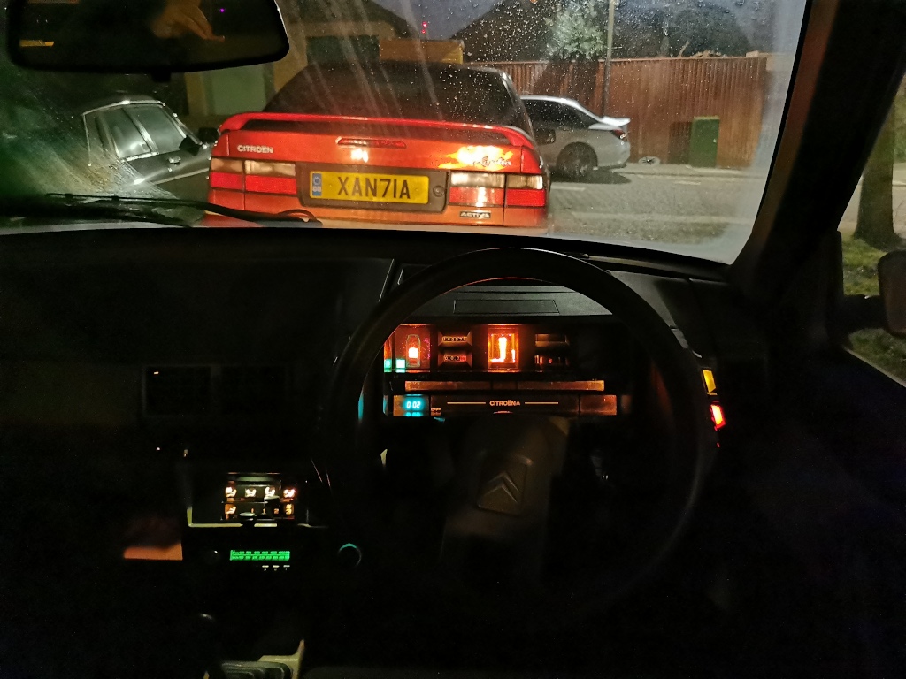 General overview of the dash illumination in a 1983 Citroen BX14RE after dark