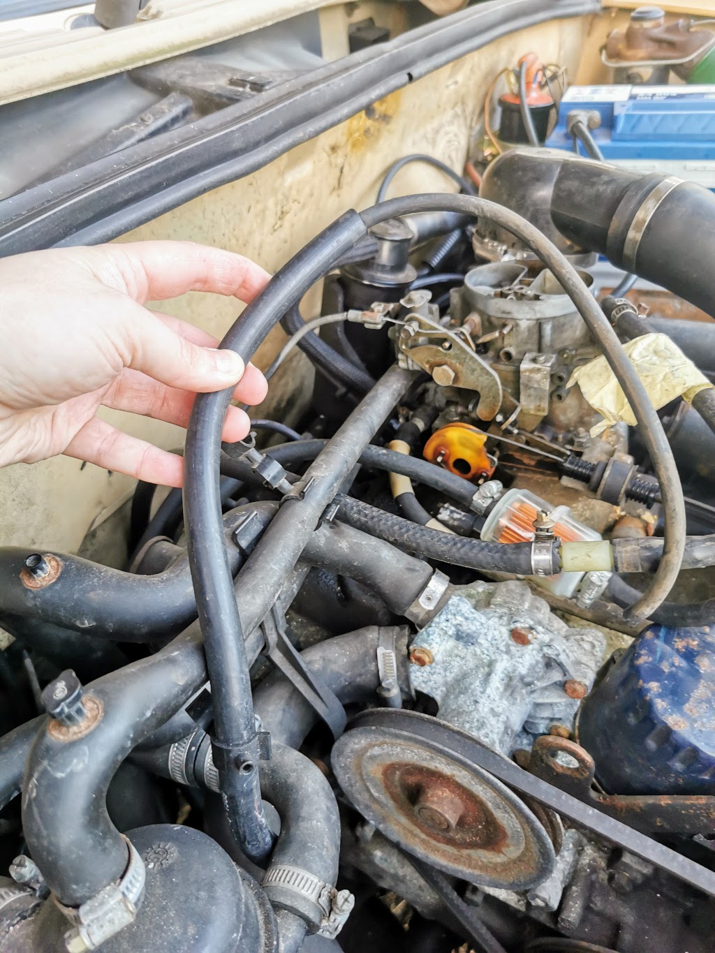 Detail showing the other end of the fuel feed line going to the pump, which initially looked like a vacuum line