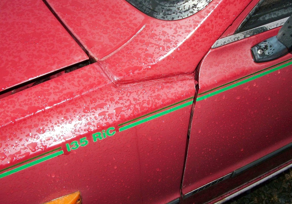 Detail of the "135 RiC" badging and pinstriping on a 1991 Skoda 135 Rapid