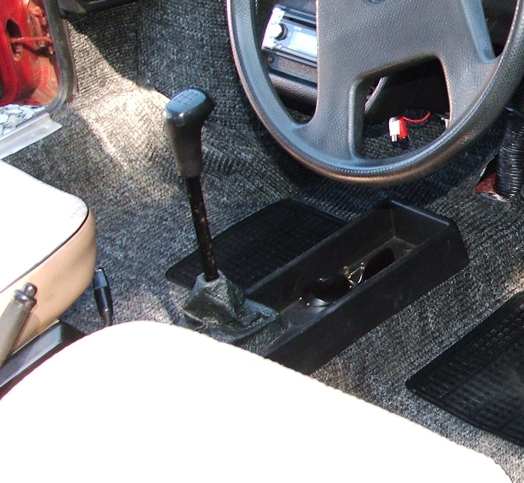 Detail of storage tray and style of gear knob on a 1991 Skoda 135 Rapid