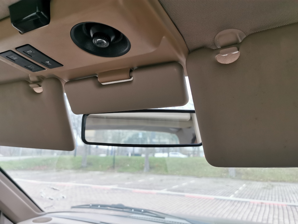 Additional miniature sun visor can be deployed to block glare from between the other two