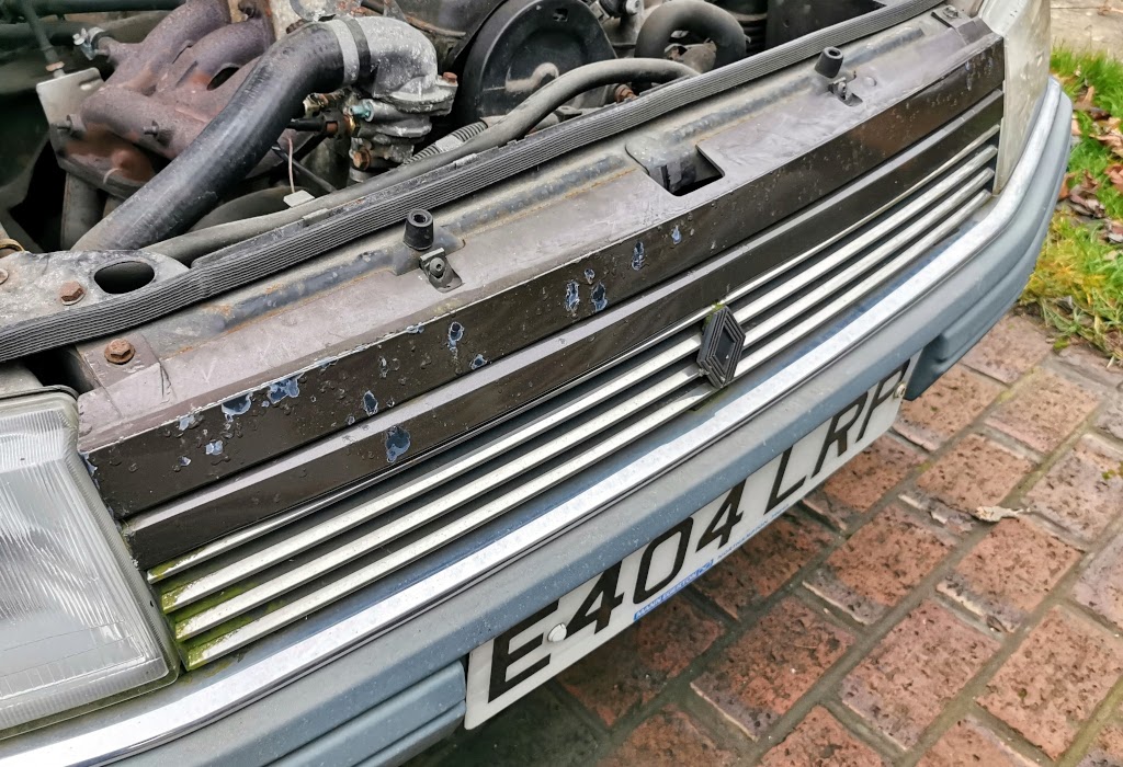 Significant clearcoat peel on the radiator grill