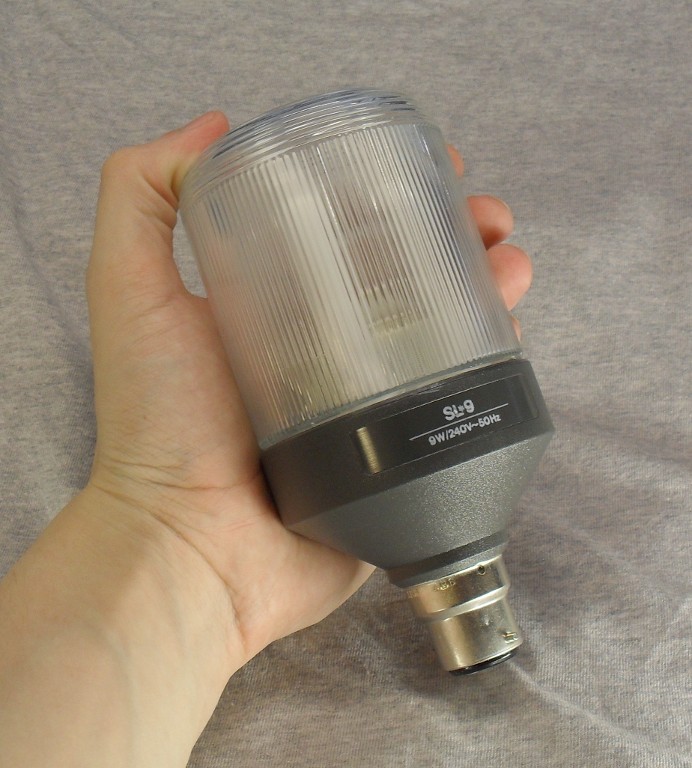 Philips SL*9 Prismatic Compact Fluorescent Lamp - Shown held in hand to show scale of lamp