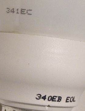 General Electric BIAX Electronic, FLE11TBX/XM/GLS/827/B22/GEUK/1 Compact Fluorescent Lamp - Detail of text (date code?) on lamp base