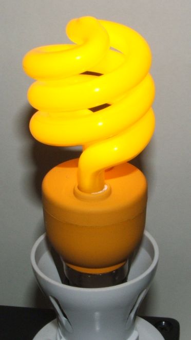 Impact Color Spiral 15W Yellow Compact Fluorescent Lamp - Overview of lamp shown lit