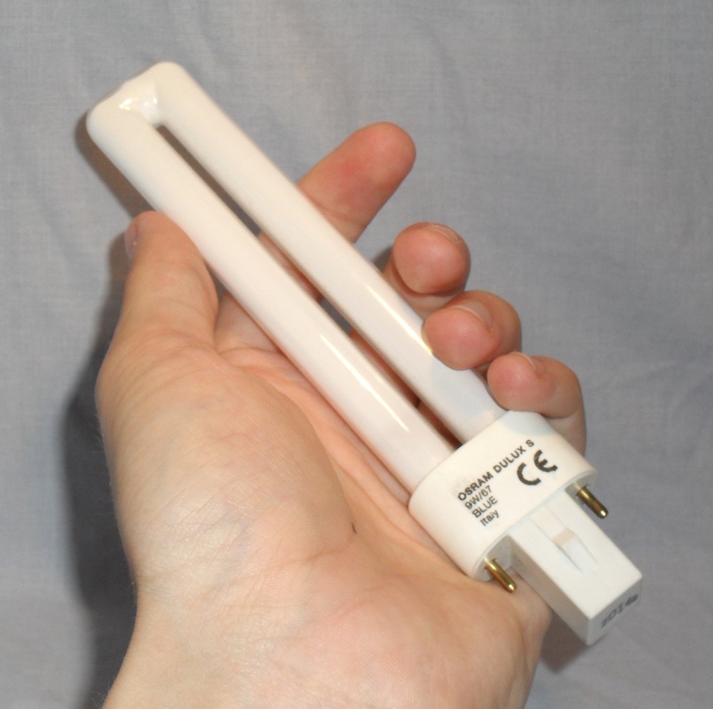 Osram Dulux S G23 9W/67 Blue Compact Fluorescent Lamp - Lamp shown held in hand for scale