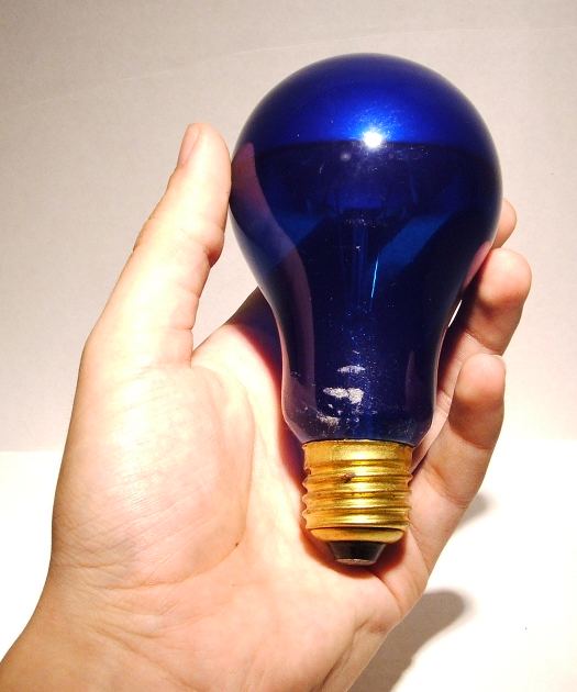 Atlas 100W Crown Silvered Blue Coloured Lamp - Held in hand to give relative scale