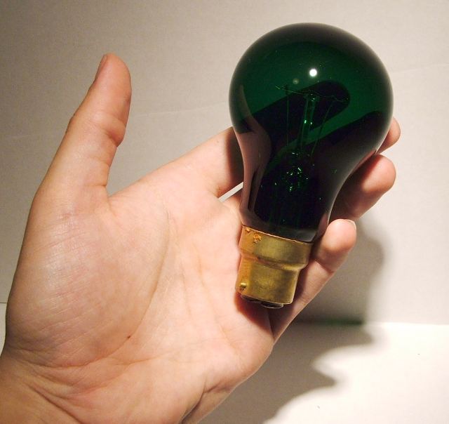 Kingston 60W Green Coloured Lamp - shown held in hand for scale