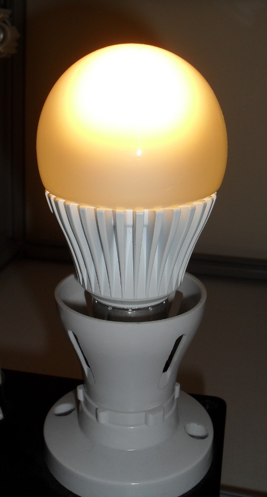 Philips Econic 7W A60 Warm White LED Lamp shown while alight