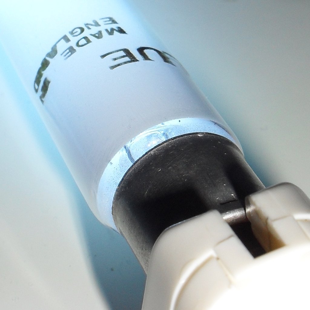 Endura F8T5 Blue Coloured Fluorescent Tube - Detail showing gap between lamp cap and phosphor while lamp is lit