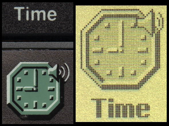 Detail of the "Time" shortcut key and application icon on an Acorn Pocket Book II