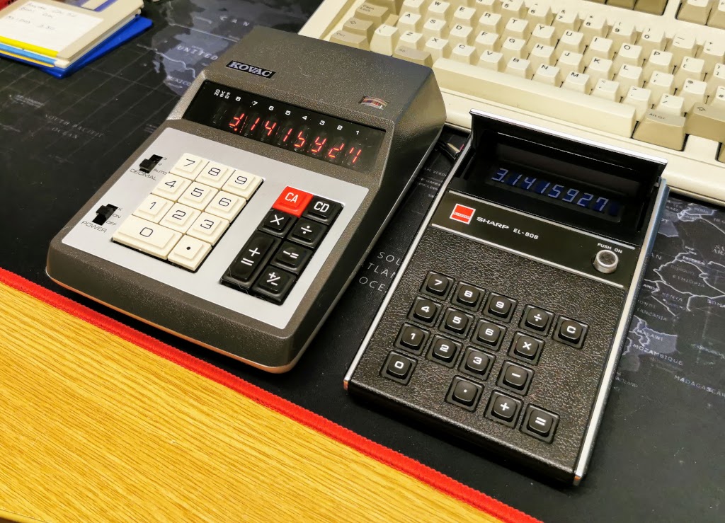 Size comparison of Kovac K-80D (left) and Sharp EL-808 (Right), IBM Model-M Keyboard in background