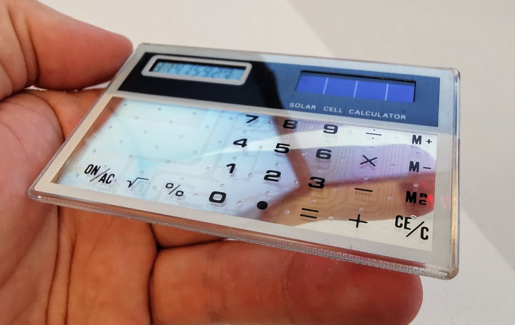 Close up with contrast enhanced to show keypad circuitry detail on the generic transparent calculator