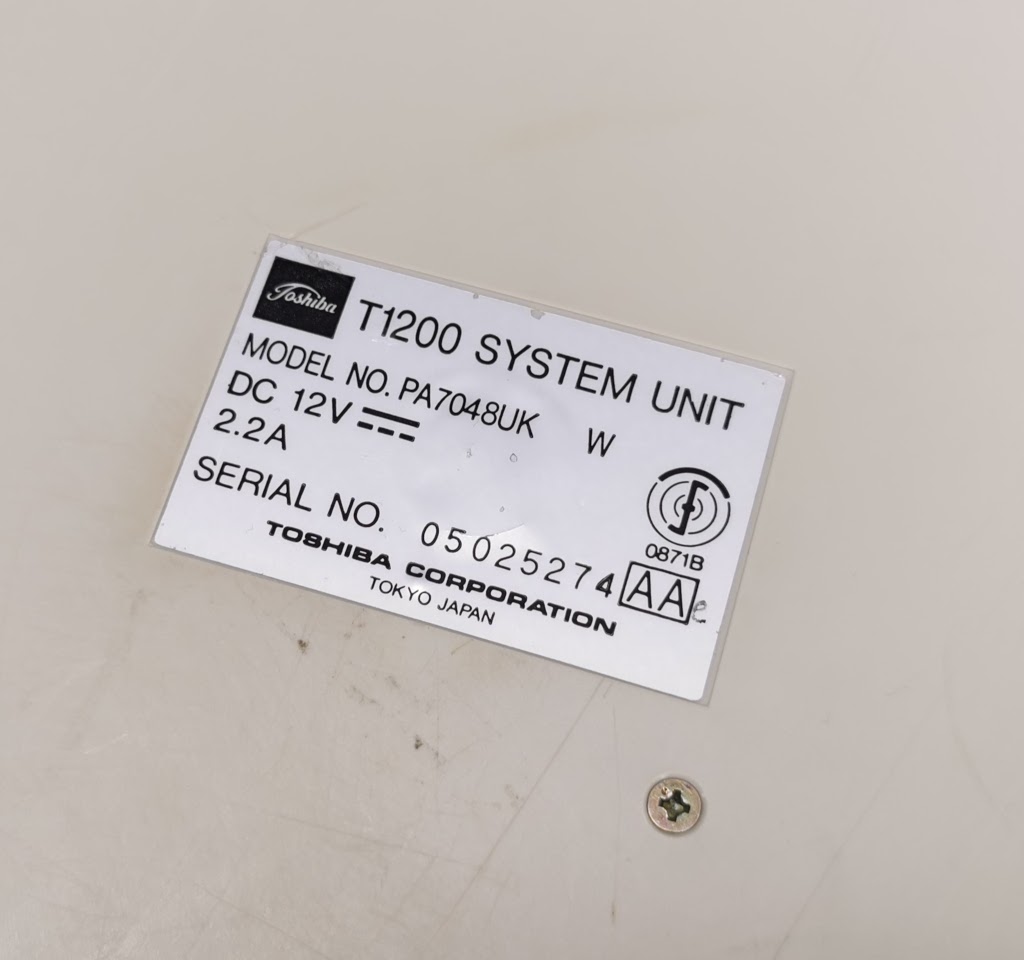 Detail of Toshiba T1200 model and serial number label