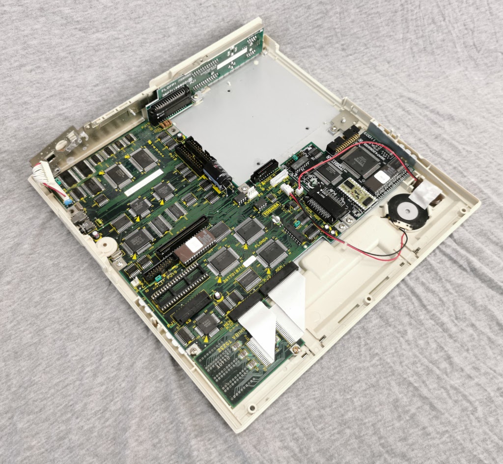 Toshiba T1200 with top cover and major assemblies removed viewed from the left