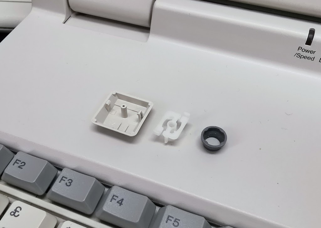 Detail of keyboard spring components on a Toshiba T1950CT, removed to show construction