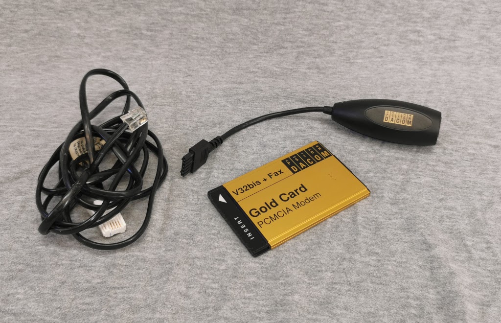 Psion Datacom Gold Card PCMCIA Modem and interface cables